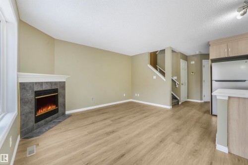 33 4020 21 Street, Edmonton, AB - Indoor Photo Showing Living Room With Fireplace