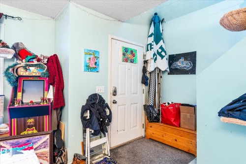 Bedroom with carpet floors and a textured ceiling - 15035 133 Street, Edmonton, AB - Indoor