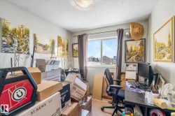 Carpeted office space featuring a textured ceiling - 
