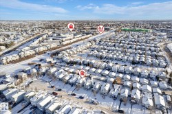Snowy aerial view featuring a residential view - 