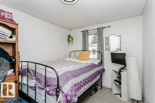 Bedroom featuring carpet flooring and a textured ceiling - 216 53222 Rge Rd 272, Rural Parkland County, AB - Indoor Photo Showing Bedroom