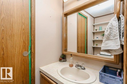 Bathroom with vanity and crown molding - 216 53222 Rge Rd 272, Rural Parkland County, AB - Indoor Photo Showing Bathroom