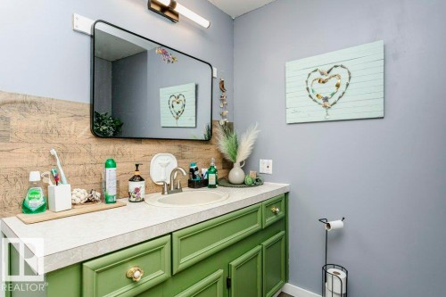 Bathroom featuring decorative backsplash and vanity - 216 53222 Rge Rd 272, Rural Parkland County, AB - Indoor Photo Showing Bathroom