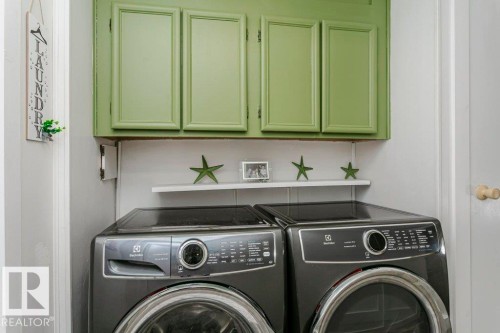 Laundry room with washer and clothes dryer and cabinet space - 216 53222 Rge Rd 272, Rural Parkland County, AB - Indoor Photo Showing Laundry Room