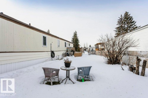 Snowy yard with a wooden deck - 216 53222 Rge Rd 272, Rural Parkland County, AB - Outdoor
