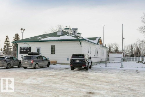 View of property exterior featuring a gate - 216 53222 Rge Rd 272, Rural Parkland County, AB - Outdoor