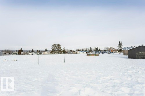 View of yard layered in snow - 216 53222 Rge Rd 272, Rural Parkland County, AB - Outdoor With View