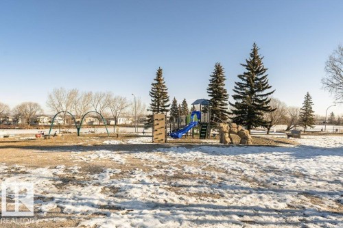 Snow covered playground with a playground - 216 53222 Rge Rd 272, Rural Parkland County, AB - Outdoor With View