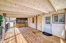 Deck off of front door with roof over top. Gate for access to back yard. - 404 Evergreen Park, Edmonton, AB  - Outdoor With Deck Patio Veranda With Exterior 