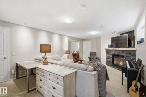22 Lamplight Bay, Spruce Grove, AB - Indoor Photo Showing Living Room With Fireplace