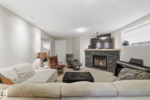22 Lamplight Bay, Spruce Grove, AB - Indoor Photo Showing Living Room With Fireplace