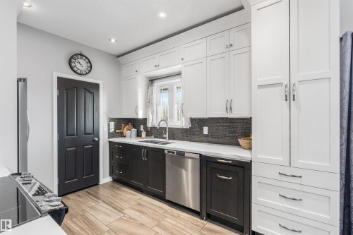 103 52318 Rge Road 25, Rural Parkland County, AB - Indoor Photo Showing Kitchen With Double Sink