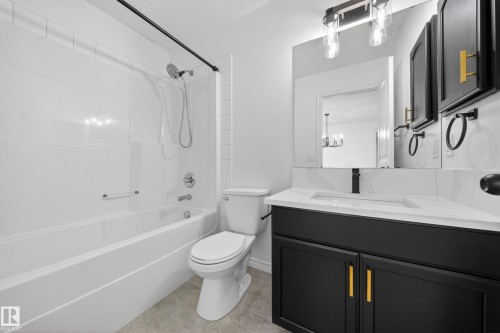 Bathroom featuring vanity and washtub / shower combination - 1741 63A Street, Edmonton, AB - Indoor Photo Showing Bathroom