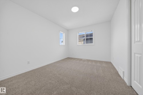 Spare room with carpet flooring and baseboards - 1741 63A Street, Edmonton, AB - Indoor Photo Showing Other Room