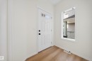 Foyer with light wood-style flooring and baseboards - 1741 63A Street, Edmonton, AB  - Indoor Photo Showing Other Room 