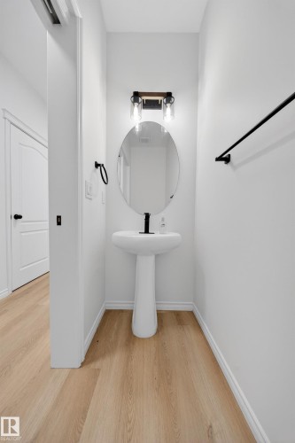 Bathroom with light wood-style flooring and baseboards - 1741 63A Street, Edmonton, AB - Indoor Photo Showing Bathroom
