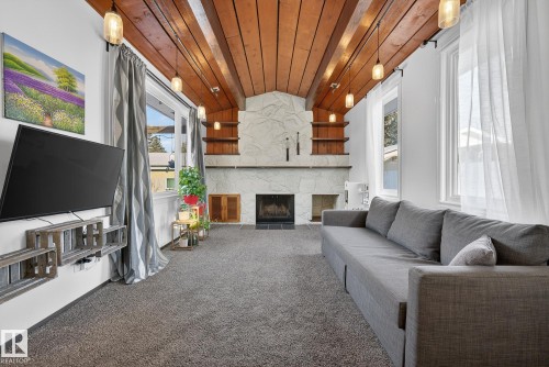 11508 35A Avenue, Edmonton, AB - Indoor Photo Showing Living Room With Fireplace