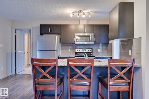 101 142 Ebbers Boulevard, Edmonton, AB - Indoor Photo Showing Kitchen With Stainless Steel Kitchen