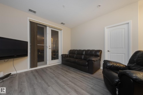 317 6083 Maynard Way, Edmonton, AB - Indoor Photo Showing Living Room