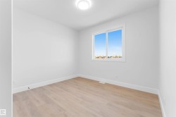 Unfurnished room with light wood-style floors and baseboards - 