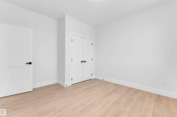 Unfurnished bedroom with light wood-type flooring and a closet - 