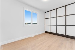 Unfurnished bedroom featuring baseboards and light wood-type flooring - 