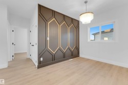 Spare room featuring light wood-style flooring - 