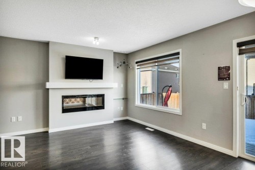 2437 Cassidy Way, Edmonton, AB - Indoor Photo Showing Living Room With Fireplace