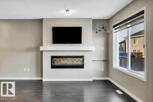 2437 Cassidy Way, Edmonton, AB - Indoor Photo Showing Living Room With Fireplace