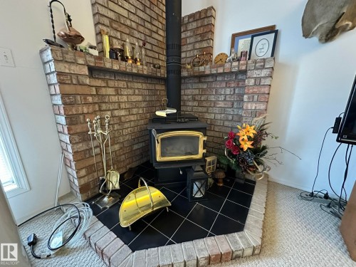 59059 Range 170, Rural Smoky Lake County, AB - Indoor Photo Showing Other Room With Fireplace