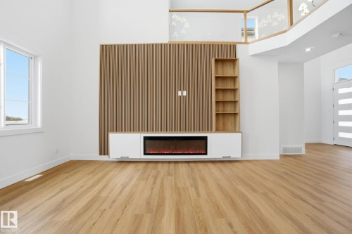 142 Edgewater Circle, Leduc, AB - Indoor Photo Showing Other Room With Fireplace