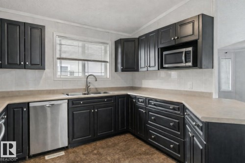 1011 Aspen Drive E, Leduc, AB - Indoor Photo Showing Kitchen With Double Sink