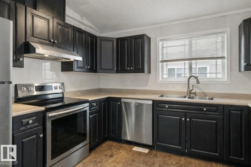 1011 Aspen Drive E, Leduc, AB - Indoor Photo Showing Kitchen With Double Sink
