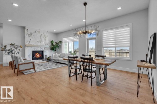2003 Genesis Lane, Stony Plain, AB - Indoor Photo Showing Dining Room With Fireplace