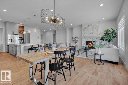 2003 Genesis Lane, Stony Plain, AB - Indoor Photo Showing Dining Room With Fireplace
