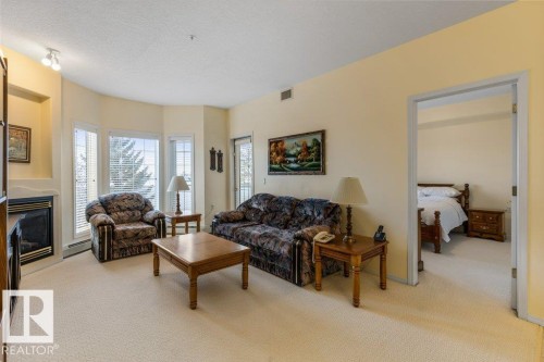 313 11260 153 Avenue, Edmonton, AB - Indoor Photo Showing Living Room With Fireplace