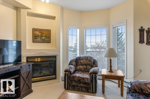 313 11260 153 Avenue, Edmonton, AB - Indoor Photo Showing Living Room With Fireplace