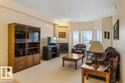 313 11260 153 Avenue, Edmonton, AB - Indoor Photo Showing Living Room With Fireplace