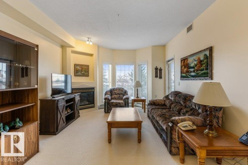 313 11260 153 Avenue, Edmonton, AB - Indoor Photo Showing Living Room With Fireplace