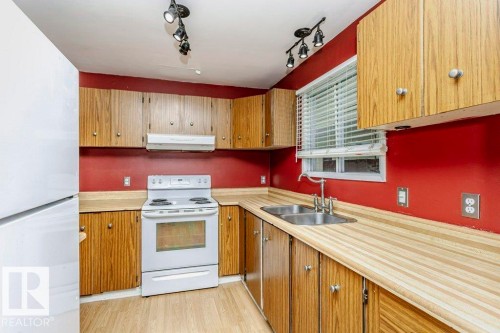 3518 42A Avenue, Edmonton, AB - Indoor Photo Showing Kitchen With Double Sink
