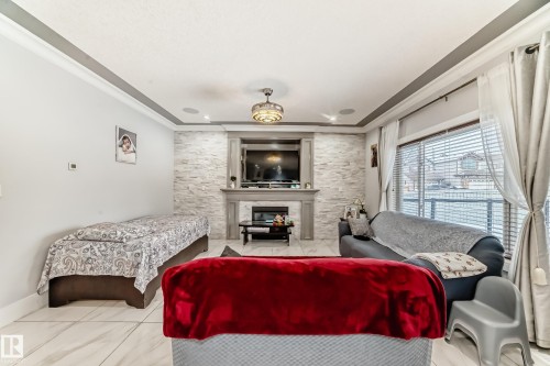 6113 60 Street, Beaumont, AB - Indoor Photo Showing Other Room With Fireplace