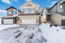 Craftsman house featuring a garage, stone siding, and a shingled roof - 2211 4 Avenue, Edmonton, AB  - Outdoor With Facade 
