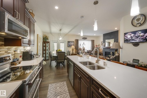 64 Maple Crescent, Gibbons, AB - Indoor Photo Showing Kitchen With Double Sink With Upgraded Kitchen