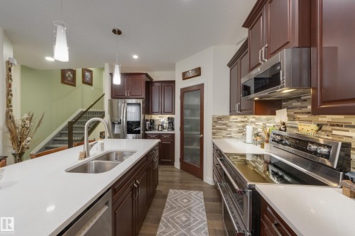 64 Maple Crescent, Gibbons, AB - Indoor Photo Showing Kitchen With Double Sink With Upgraded Kitchen