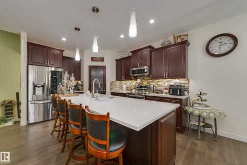 64 Maple Crescent, Gibbons, AB - Indoor Photo Showing Kitchen With Upgraded Kitchen