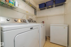 Washroom featuring washing machine and dryer and electric panel - 