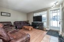Living room with a textured ceiling and light wood-style flooring - 2031 Saddleback Road, Edmonton, AB  - Indoor Photo Showing Living Room 