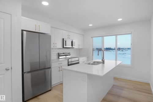 1 1215 Keswick Drive, Edmonton, AB - Indoor Photo Showing Kitchen With Double Sink With Upgraded Kitchen