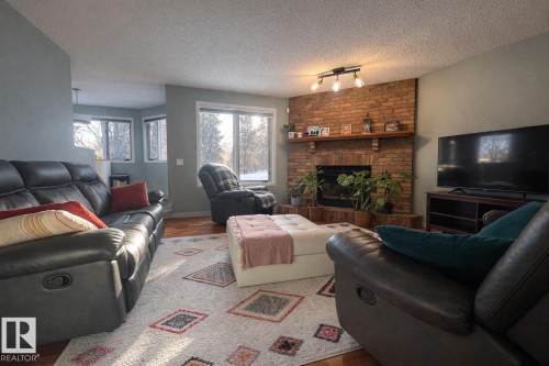 19011 92A Avenue, Edmonton, AB - Indoor Photo Showing Living Room With Fireplace