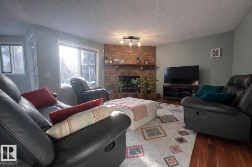 19011 92A Avenue, Edmonton, AB - Indoor Photo Showing Living Room With Fireplace
